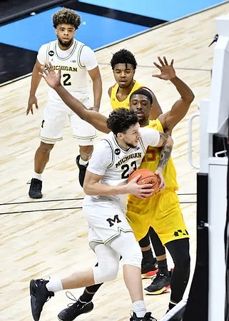 Brandon Johns Jr. (23) and Mike Smith (12)
