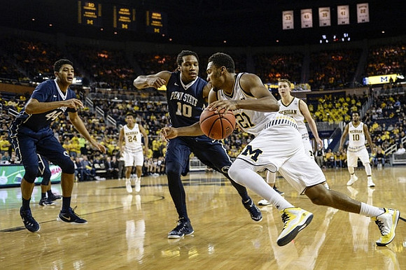 Aubrey Dawkins (24), Zak Irvin (21), Mark Donnal (34), and Derrick Walton Jr. (10)
