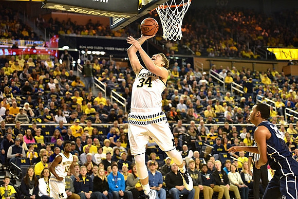 Derrick Walton Jr. (10) and Mark Donnal (34)