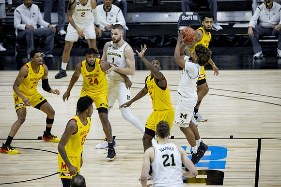 Mike Smith (12), Hunter Dickinson (1), Franz Wagner (21), and Isaiah Livers (2)