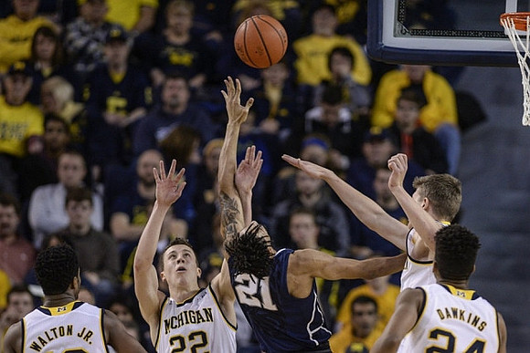 Derrick Walton Jr. (10), Duncan Robinson (22), Moritz Wagner (13), and Aubrey Dawkins (24)