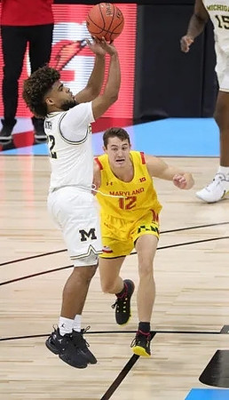 Mike Smith (12) and Chaundee Brown Jr. (15)