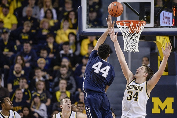 Muhammad-Ali Abdur-Rahkman (12), Duncan Robinson (22), and Mark Donnal (34)