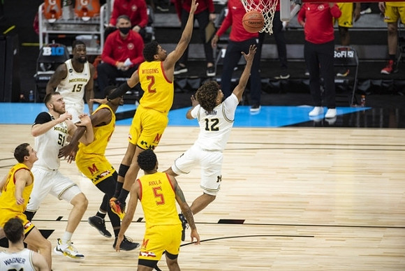 Mike Smith (12), Franz Wagner (21), Austin Davis (51), and Chaundee Brown Jr. (15)