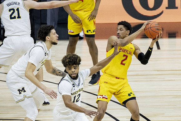 Franz Wagner (21), Brandon Johns Jr. (23), and Mike Smith (12)