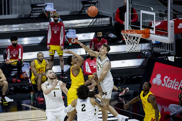 Hunter Dickinson (1), Isaiah Livers (2), and Franz Wagner (21)