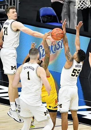Franz Wagner (21), Hunter Dickinson (1), and Eli Brooks (55)