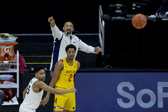 Eli Brooks (55) and Juwan Howard