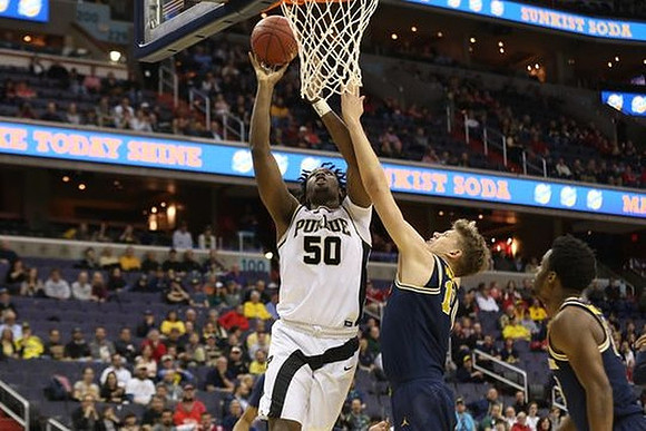 Moritz Wagner (13) and Derrick Walton Jr. (10)