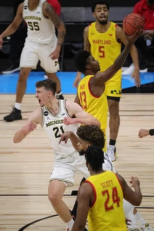 Franz Wagner (21), Eli Brooks (55), and Mike Smith (12)
