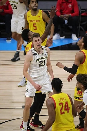 Franz Wagner (21), Eli Brooks (55), and Mike Smith (12)