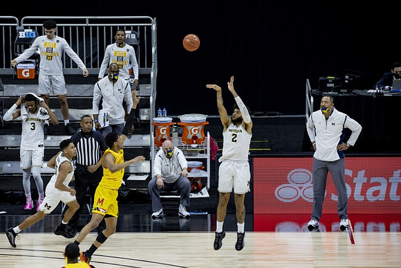 Eli Brooks (55), Isaiah Livers (2), and Juwan Howard