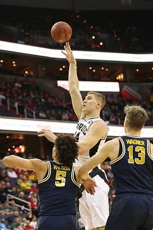 D.J. Wilson (5) and Moritz Wagner (13)