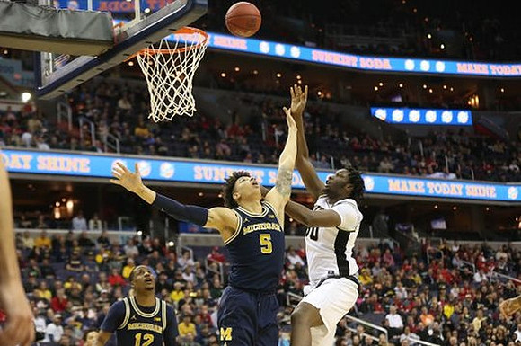 Muhammad-Ali Abdur-Rahkman (12) and D.J. Wilson (5)