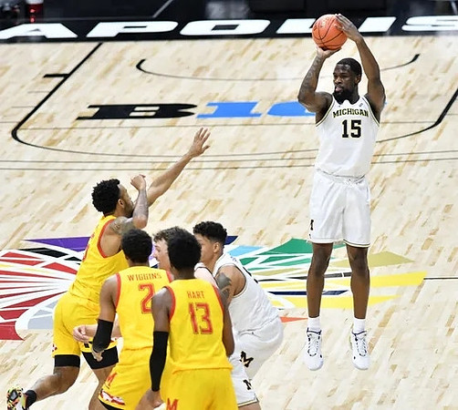 Franz Wagner (21), Eli Brooks (55), and Chaundee Brown Jr. (15)