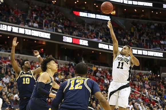 Derrick Walton Jr. (10), D.J. Wilson (5), and Muhammad-Ali Abdur-Rahkman (12)