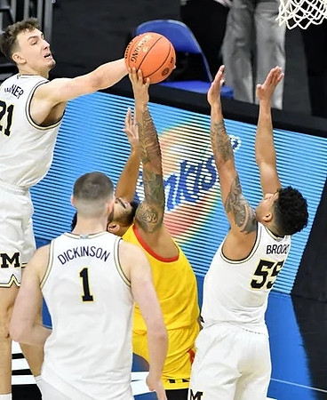 Franz Wagner (21), Hunter Dickinson (1), and Eli Brooks (55)