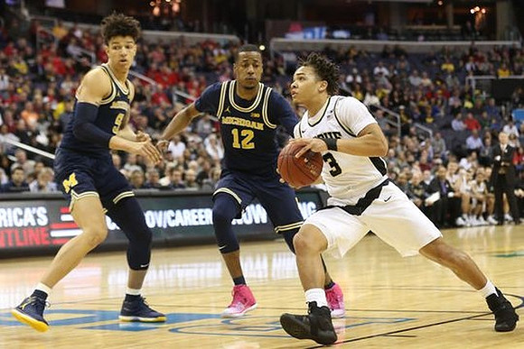 D.J. Wilson (5) and Muhammad-Ali Abdur-Rahkman (12)