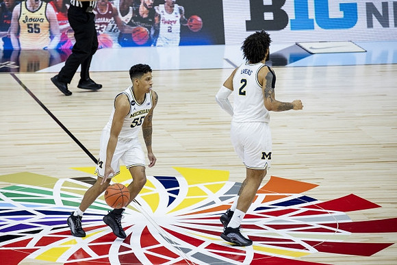 Eli Brooks (55) and Isaiah Livers (2)