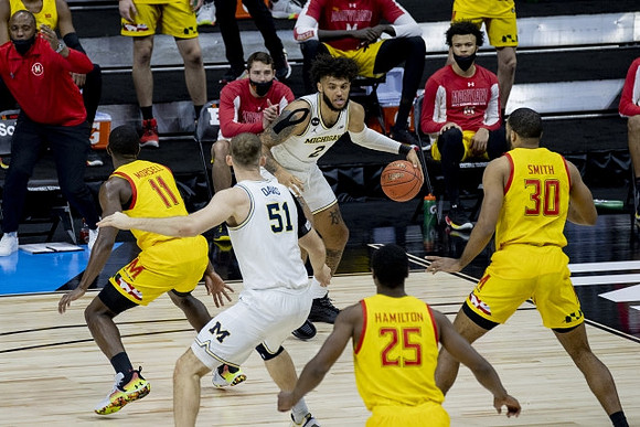 Austin Davis (51) and Isaiah Livers (2)