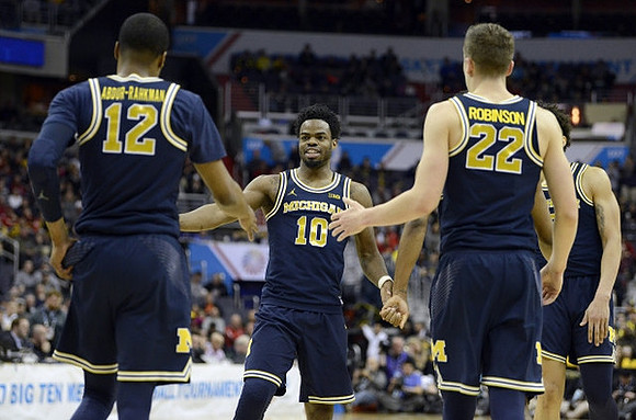 Muhammad-Ali Abdur-Rahkman (12), Derrick Walton Jr. (10), Duncan Robinson (22), and D.J. Wilson (5)
