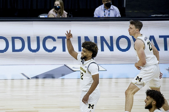 Mike Smith (12), Franz Wagner (21), and Isaiah Livers (2)
