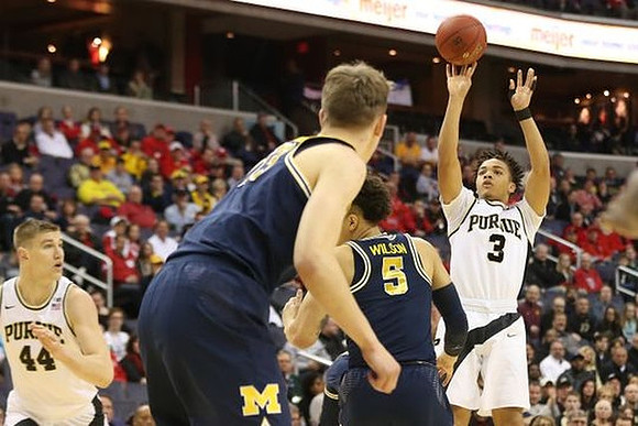 Moritz Wagner (13) and D.J. Wilson (5)