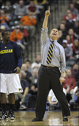 Corey Person (32) and John Beilein