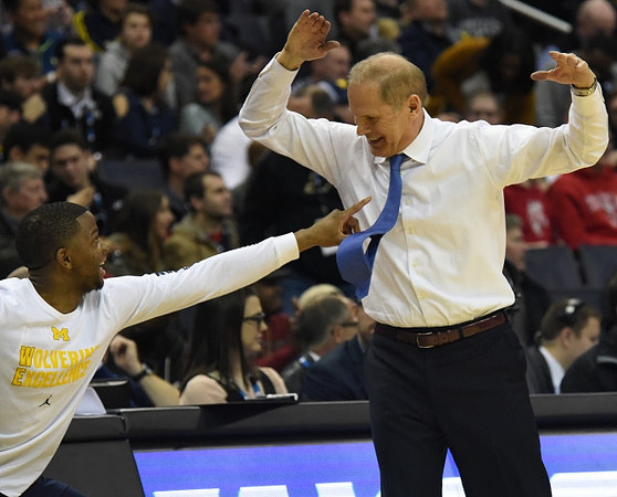 Xavier Simpson (3) and John Beilein