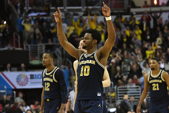 Muhammad-Ali Abdur-Rahkman (12), Duncan Robinson (22), Derrick Walton Jr. (10), and Zak Irvin (21)