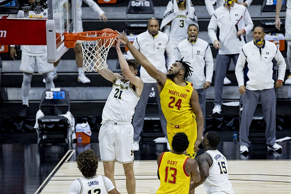 Mike Smith (12), Franz Wagner (21), and Chaundee Brown Jr. (15)