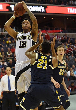 John Beilein, Zak Irvin (21), and Duncan Robinson (22)