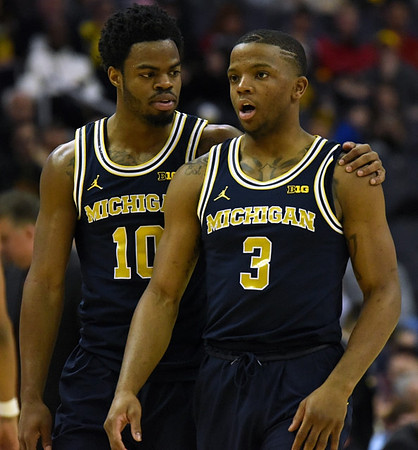 Derrick Walton Jr. (10) and Xavier Simpson (3)