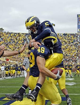 John McColgan (49) and Tate Forcier (5)