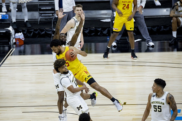 Mike Smith (12), Chaundee Brown Jr. (15), Franz Wagner (21), and Eli Brooks (55)