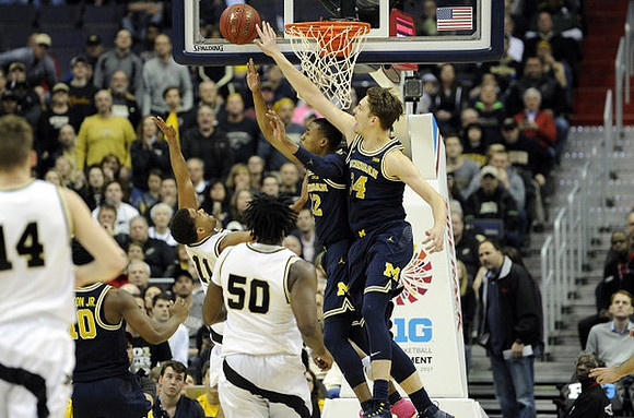 Derrick Walton Jr. (10), Muhammad-Ali Abdur-Rahkman (12), and Mark Donnal (34)
