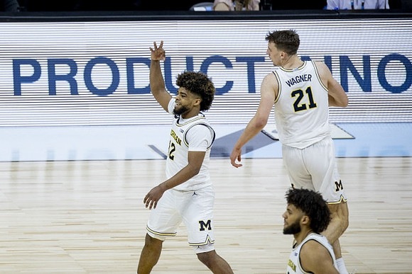 Mike Smith (12), Franz Wagner (21), and Isaiah Livers (2)