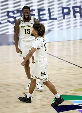 Mike Smith (12) and Chaundee Brown Jr. (15)