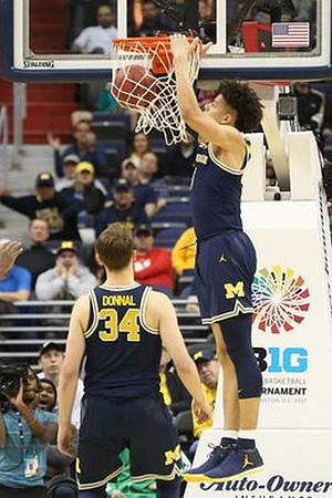 Mark Donnal (34) and D.J. Wilson (5)
