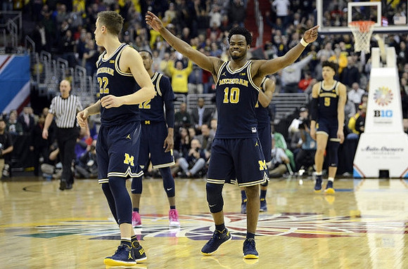 Duncan Robinson (22), Muhammad-Ali Abdur-Rahkman (12), Derrick Walton Jr. (10), and D.J. Wilson (5)