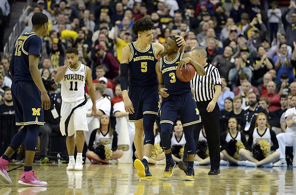 Muhammad-Ali Abdur-Rahkman (12), D.J. Wilson (5), and Xavier Simpson (3)