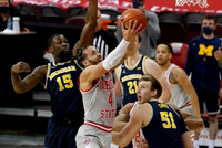 Chaundee Brown Jr. (15), Franz Wagner (21), and Austin Davis (51)