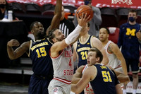 Chaundee Brown Jr. (15), Franz Wagner (21), and Austin Davis (51)