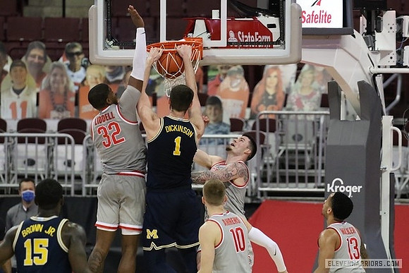 Hunter Dickinson (1) and Chaundee Brown Jr. (15)