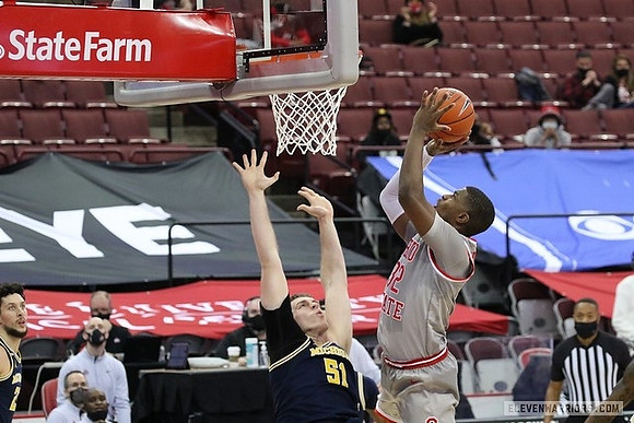 Brandon Johns Jr. (23) and Austin Davis (51)