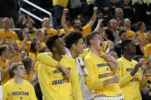 Aubrey Dawkins (24), D.J. Wilson (5), Moritz Wagner (13), and Caris LeVert (23)