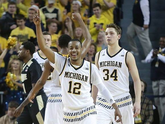 Muhammad-Ali Abdur-Rahkman (12) and Mark Donnal (34)