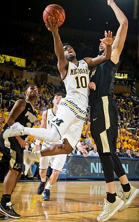 Derrick Walton Jr. (10) and Ricky Doyle (32)