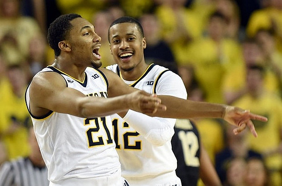 Zak Irvin (21) and Muhammad-Ali Abdur-Rahkman (12)