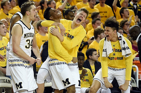 Mark Donnal (34), Aubrey Dawkins (24), Moritz Wagner (13), and D.J. Wilson (5)
